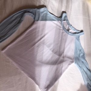 white croptop with blue sleeves, cuts on shoulders